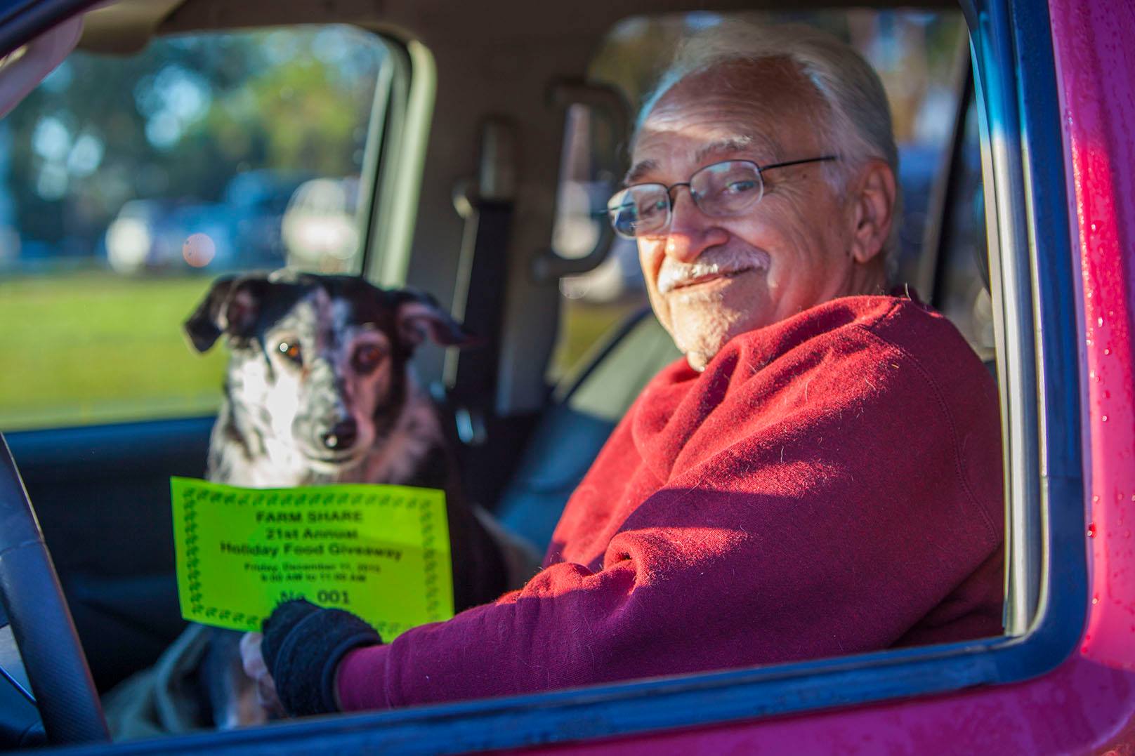 Minister Tony Locacio, 74, of Hudson, along with Katie, his 11-yea-old rescue Border Collie/Australian Cattle Dog, arrived 9 p.m. Thursday evening to be the first in line at Friday's 21st Annual Farm Share Holiday Food Giveaway at Faith Baptist Church in New Port Richey. Locacio has fallen on hard times with health issues in recent years and moved in with his widowed sister-in-law Caroline to help her with her dire health issues and to keep a roof over both of their heads. 