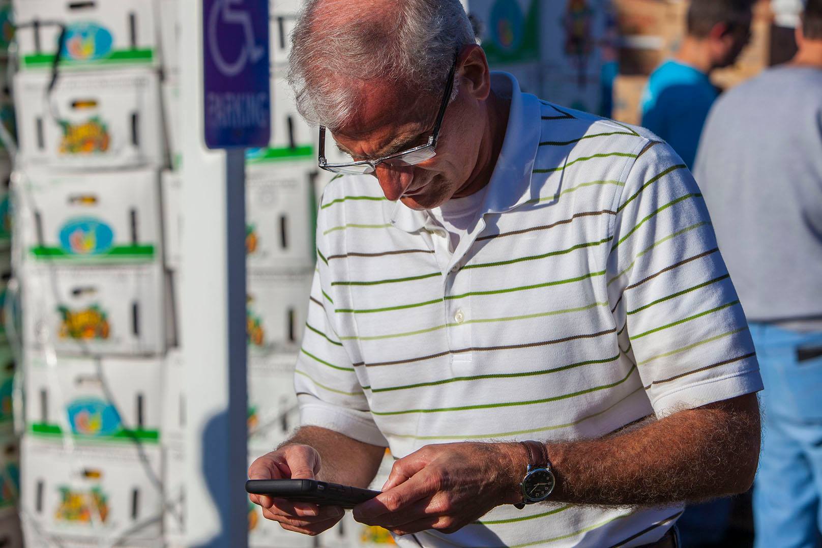 Pasco County Tax Collector Mike Fasano, who started the annual Farm Share Holiday Food Giveaway 21 years ago, arrived before 7 a.m. Friday with his office staff, to continue coordinating the event's logistics and volunteers.